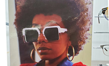 Coco and Breezy eyewear line ad with woman in sunglasses